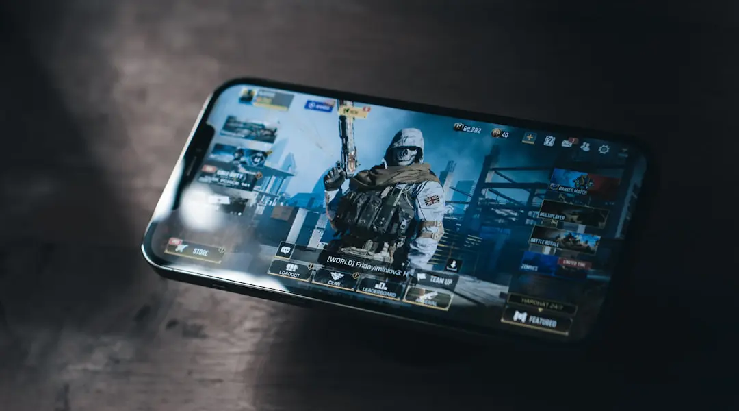 a person holding a cell phone with a video game on the screen