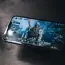 a person holding a cell phone with a video game on the screen