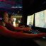 Two men playing video games on computers