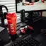 red and black tumbler beside black computer keyboard